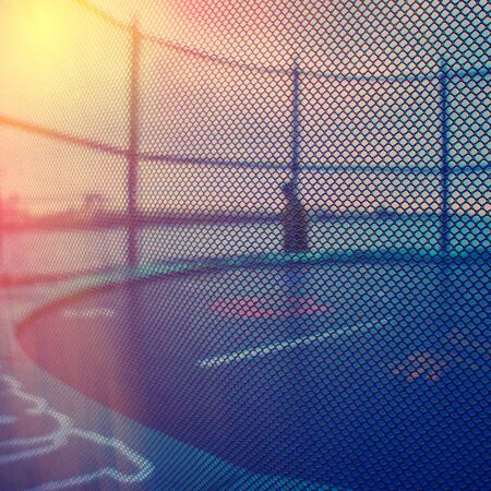 guards and a passerby in an urban gridの写真素材