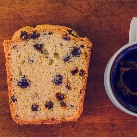 cup of coffee and cake on the boardの写真素材