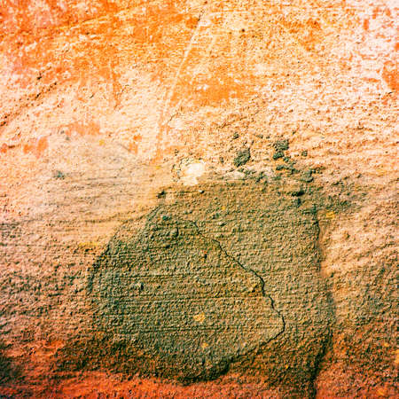concrete wall with fragments of old plaster restorationの写真素材
