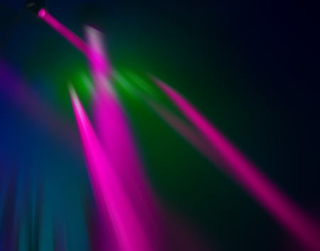 blurred background, the beams of searchlights on the background of dark scenesの写真素材