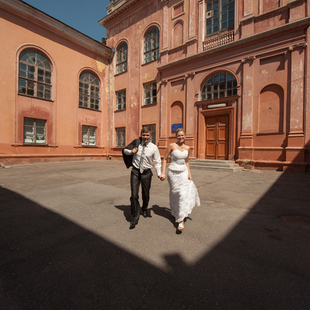 emotional flirting bride and groom on the moveの写真素材