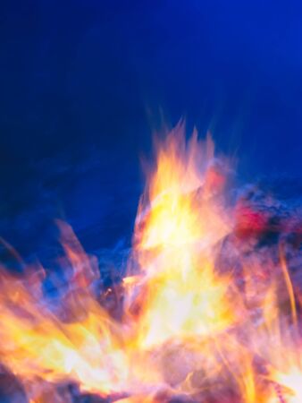 blurred background, flames of fire smoldering in the background...