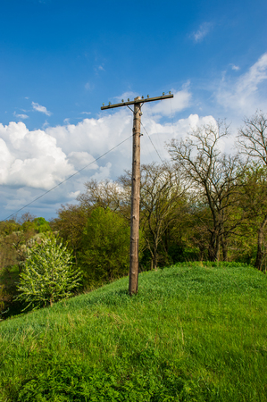 rural landscape old wooden post and blue skyの写真素材