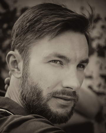 Bearded handsome man looking awayの写真素材