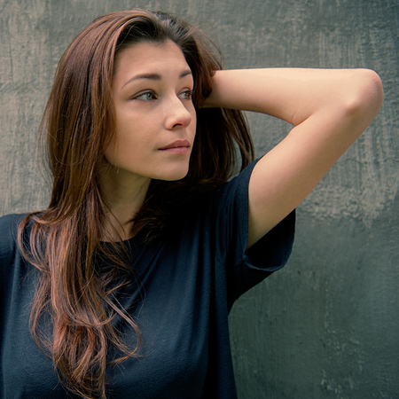 Beautiful woman straightens loose hair