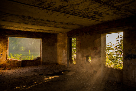 Window openings in an old abandoned building and the morning lightの写真素材