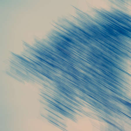 Abstract diagonal spots and lines in blue tonality, blurred background