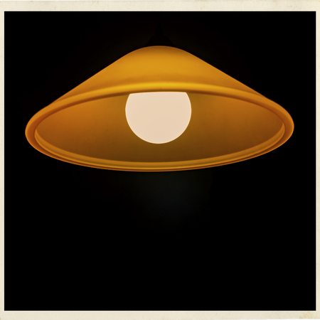 Lamp on a dark background indoors blurred background.