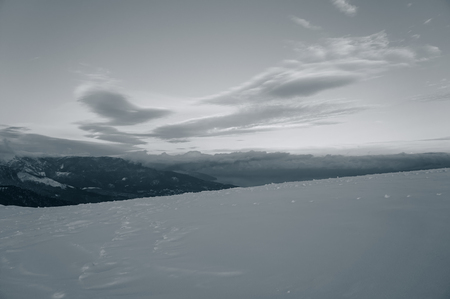 Snow and sky in the mountains in the evening. Background for web page design.の写真素材