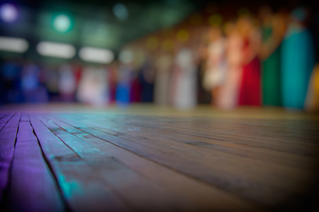 lurred silhouettes of people and dance floor in an open area