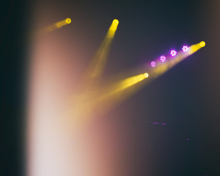 light during a concert, stage light with colored spotlights, pink, yellow, softの写真素材