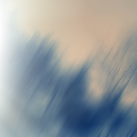 Abstract blurred yellow background. Diagonal blue colored lines and spots on the yellow. Design element.の写真素材