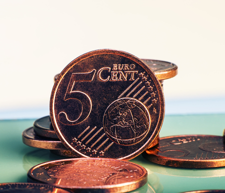 coins five euro cents lie on a pile of coins. Coins on the blurred background. Currency of the European Union.の写真素材