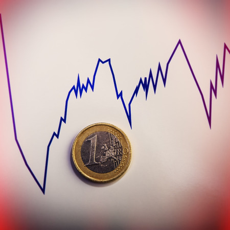 coin one euro against the currency rate chart. Euro money.  Currency of the European Union.の写真素材