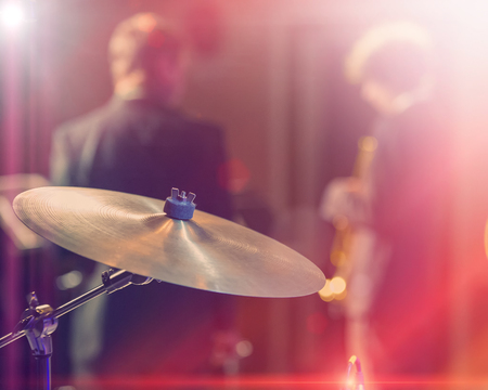 Drums and cymbals, concert performance concert, selective focus on equipment. A musician playing with chopsticks on percussion instruments.の写真素材