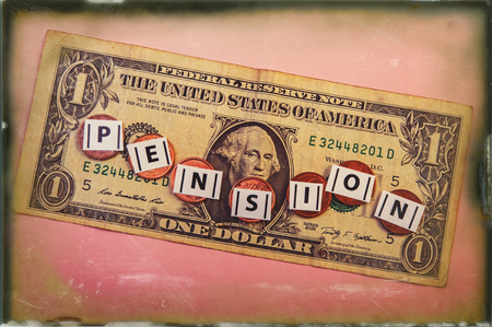 inscription pension on the background of an American one-dollar bill.