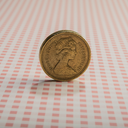 coin one pound on a brown background. Type of coins of England.の写真素材