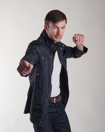 attractive successful entrepreneur is actively moving in front of the camera. Photographing in the studio.の写真素材