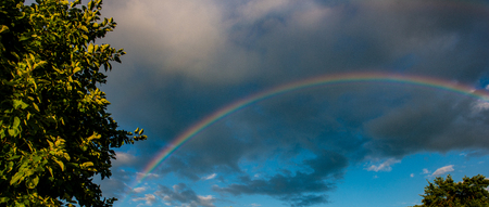 rainbow in the rain and sunset in the countryside. Web banner. Element of design. Photo banner.の写真素材