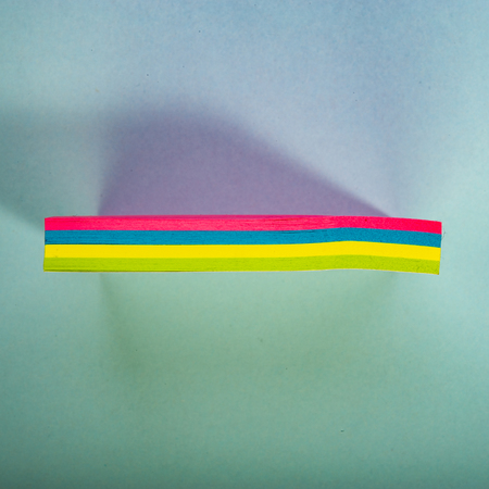 stack of stickers lies on a green background. Design element. Web banner.