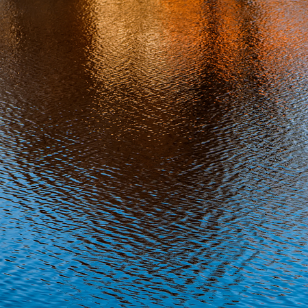 blurred background, reflection in water surface. Element of design. Background and surface.