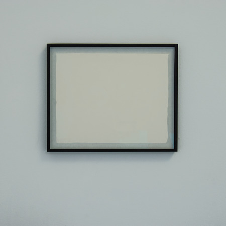 baguette frame with a white blank sheet on the wall. For web design.