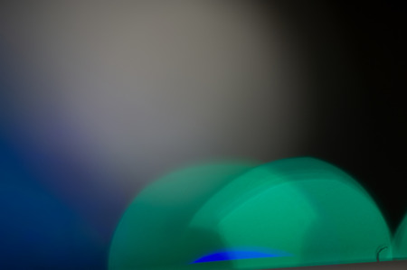 festive light illumination and light spots on a dark pastel background. Blurred background. Web design.の写真素材