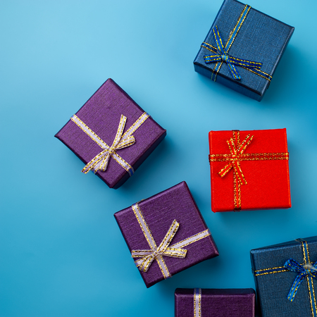 multicolored christmas boxes on blue background. Web design. For the blog.の写真素材