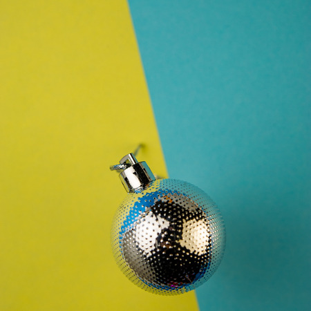 Christmas ball on a blue background. Christmas composition, winter season. For your design.の写真素材