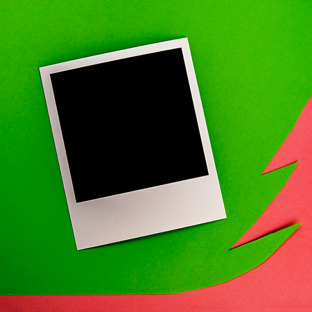 framed photograph on paper green background .Christmas composition.の写真素材