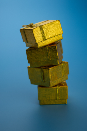 festive golden gift boxes on a blue background.Christmas composition.の写真素材