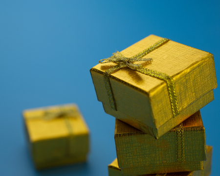 festive golden gift boxes on a blue background.Christmas composition.の写真素材