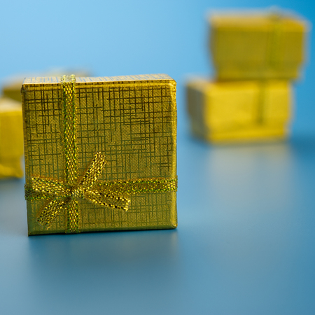 festive golden gift boxes on a blue background.Christmas composition.の写真素材