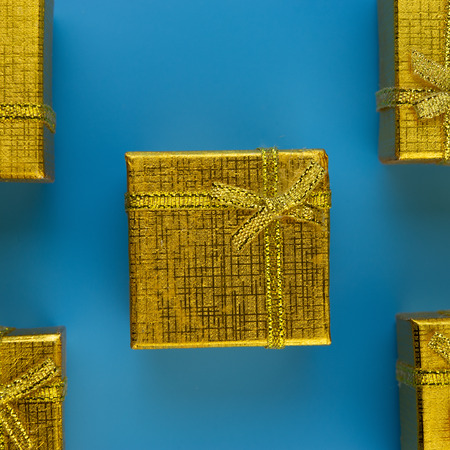 festive golden gift boxes on a blue background.Christmas composition.の写真素材