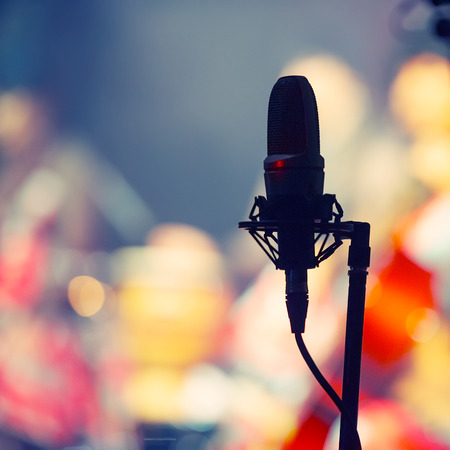 Concert microphone during the concert on a blurred background. Banner for design.の写真素材