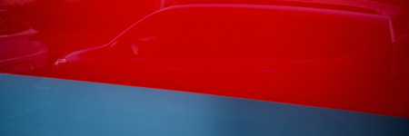 Reflection of cars in the glass of the building window. Web banner for design.の写真素材