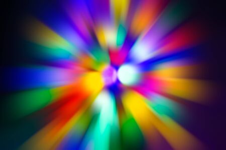 Abstract blurred color background - radial colored rays of purple, pink, green, yellow, red, black, White. For design.の写真素材