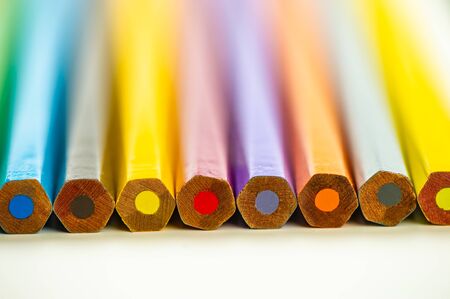 ends of colored pencils lie on a light background. For your design.の写真素材