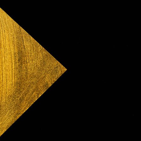 Golden triangle on a black background. Web banner.