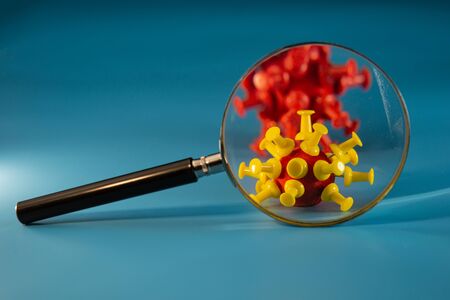 Coronavirus under a magnifying glass. Coronavirus infection (COVID â 19).の写真素材