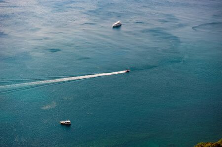 Pleasure boats at sea on a sunny day. Summer holiday season.