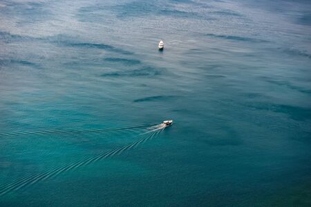 Pleasure boats at sea on a sunny day. Summer holiday season.