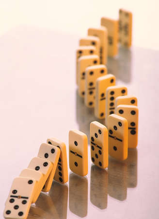 Domino stands in a curved line on a light background. Business concept.の写真素材