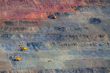 Open pit iron ore mining. Loading of mined ore and delivery by rail and dump trucks. Ukraine....