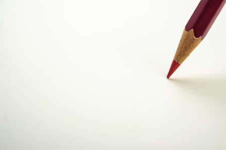 Red colored pencil on a light background. For design. Web banner.の写真素材