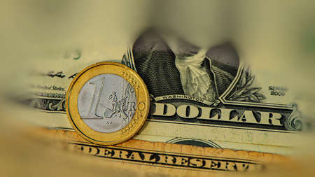 one euro coin lies on a US dollar bill. Business concept. Web banner.