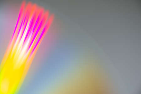 abstract composition of radial colored rays on a gray background. Web banner. Cover.