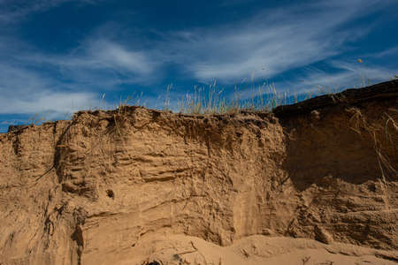 erosion in the sand dunes on a sunny day against the blue sky. Summer season, June. Ukraine. Europe. Web banner.の写真素材