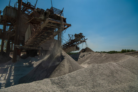 Crushing and loading gravel from granite. Industrial industry.の写真素材