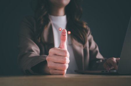 Good satisfaction feedback rating, think positive, customer review, assessment, good mood. Businesswoman thumb up showing happy smile face and red heart emotion. Compliment, world mental health day.の写真素材